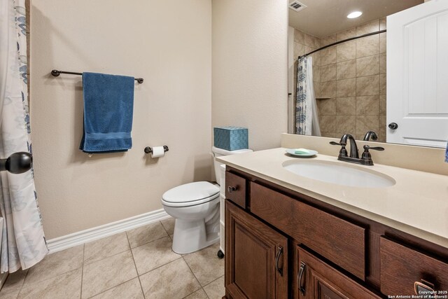 full bathroom featuring a shower with shower curtain, baseboards, toilet, tile patterned floors, and vanity