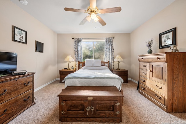 bedroom with ceiling fan, baseboards, light colored carpet, and visible vents
