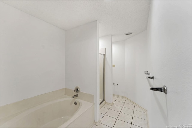 2343 Country Grace, New Braunfels, TX 78130 - full bath featuring a textured ceiling, tile patterned floors, a stall shower, a garden tub, and visible vents