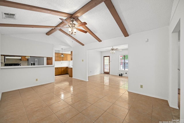 unfurnished living room featuring visible vents, light tile patterned floors, lofted ceiling with beams, a ceiling fan, and a textured ceiling