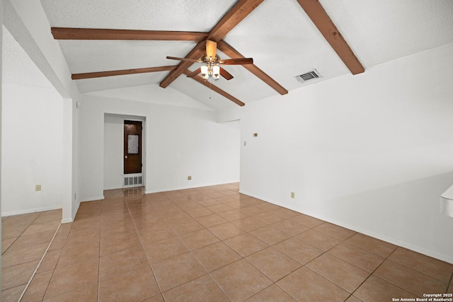 empty room with visible vents, light tile patterned floors, lofted ceiling with beams, a ceiling fan, and a textured ceiling