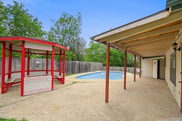 view of pool featuring a fenced in pool, a patio, and a fenced backyard