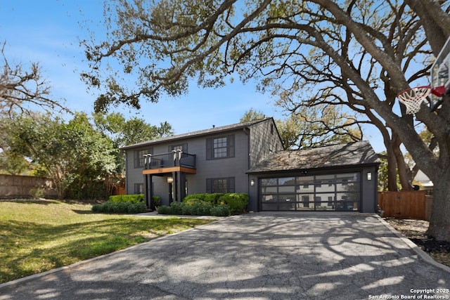 112 Coventry Ln, Terrell Hills, TX 78209 - view of front facade with driveway, a front yard, an attached garage, fence, and a balcony