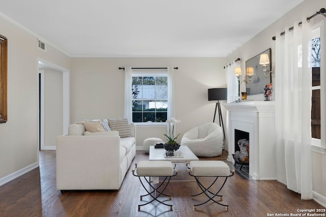 112 Coventry Ln, Terrell Hills, TX 78209 - living area featuring dark wood finished floors, baseboards, visible vents, and crown molding