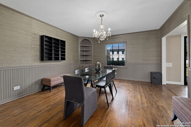 112 Coventry Ln, Terrell Hills, TX 78209 - dining area featuring wood-type flooring, wainscoting, built in features, and an inviting chandelier