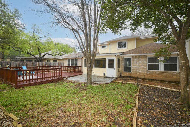 14743 Oak Briar, San Antonio, TX 78232 - rear view of house with brick siding, a sunroom, a wooden deck, and roof with shingles