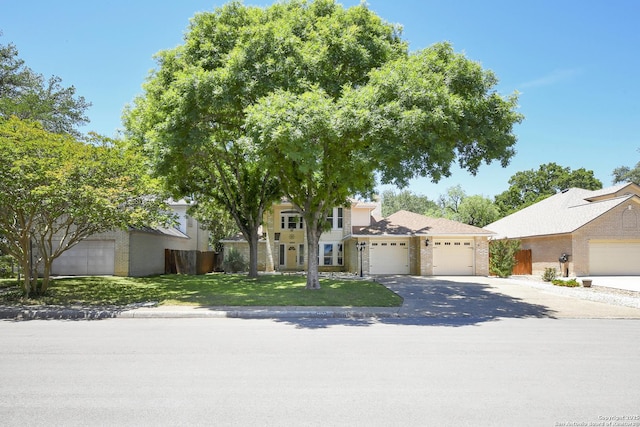 14743 Oak Briar, San Antonio, TX 78232 - view of front of home with brick siding, an attached garage, concrete driveway, and a front yard