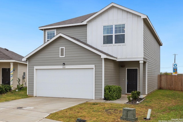 view of front of property with a front lawn, driveway, fence, and board and batten siding