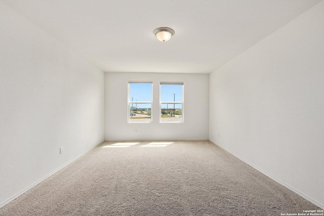 spare room featuring carpet flooring