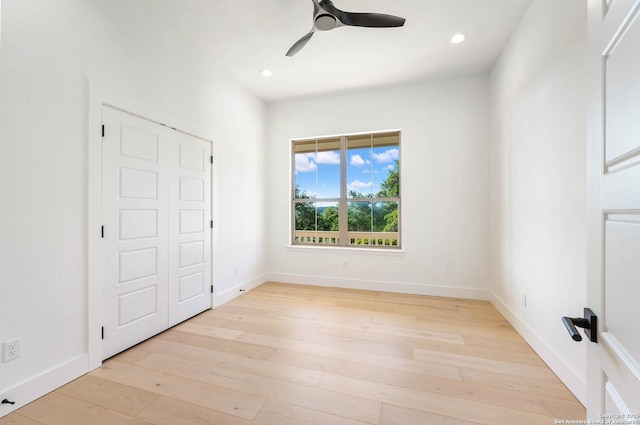 unfurnished bedroom with ceiling fan, recessed lighting, light wood-style flooring, and baseboards