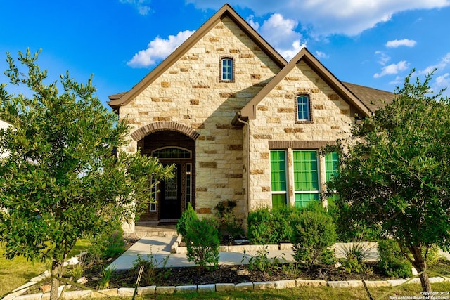 view of front of home with stone siding