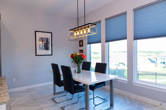 dining area featuring baseboards