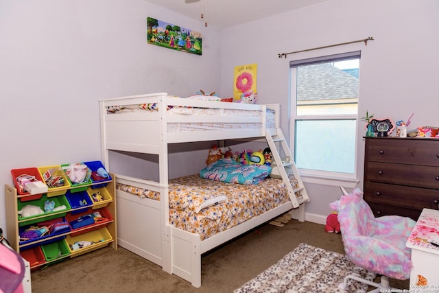 bedroom with baseboards and carpet flooring