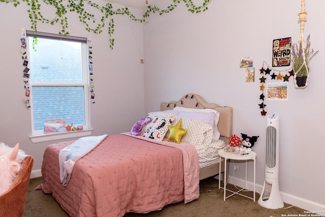 carpeted bedroom with baseboards and multiple windows