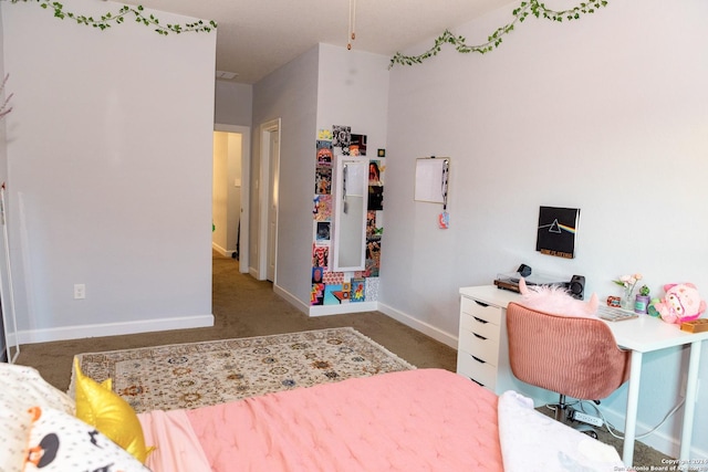 bedroom with baseboards and carpet flooring