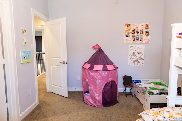 bedroom featuring carpet floors and baseboards