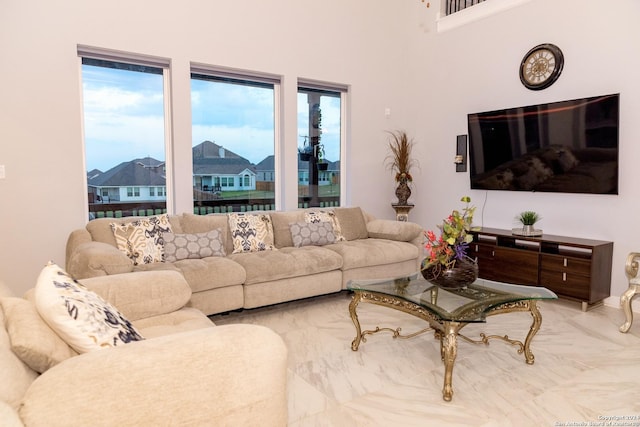living room featuring marble finish floor and a residential view
