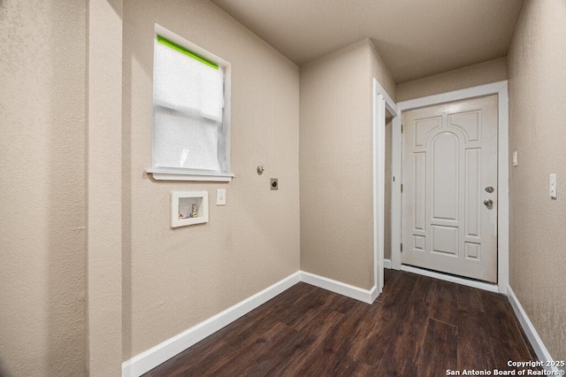 doorway with baseboards and dark wood-style flooring