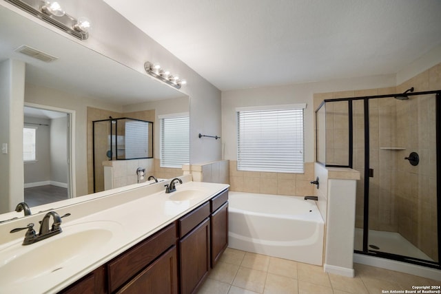 full bathroom featuring a stall shower, visible vents, tile patterned flooring, and a sink