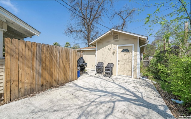 garage with fence