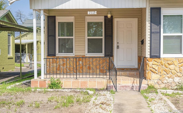 property entrance featuring covered porch
