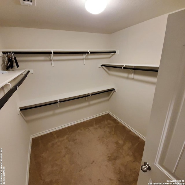 8062 Halo Cir, San Antonio, TX 78252 - spacious closet with visible vents and dark colored carpet