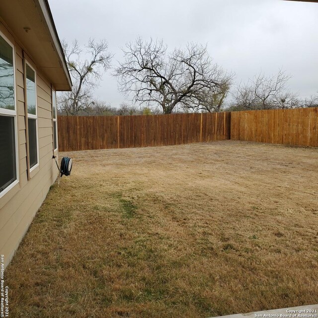 8062 Halo Cir, San Antonio, TX 78252 - view of yard featuring fence private yard