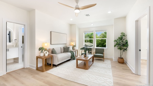 living area featuring visible vents, light wood-style floors, ceiling fan, and recessed lighting