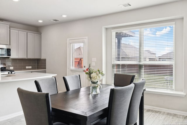 13850 Cohan Way, San Antonio, TX 78253 - dining area featuring baseboards, light wood-style floors, and visible vents