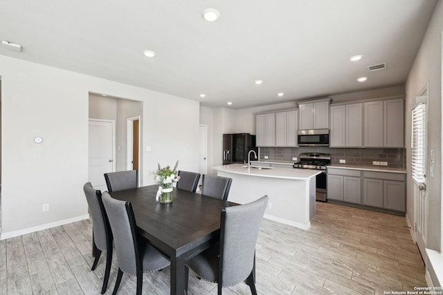 13850 Cohan Way, San Antonio, TX 78253 - dining space with light wood finished floors, baseboards, visible vents, and recessed lighting