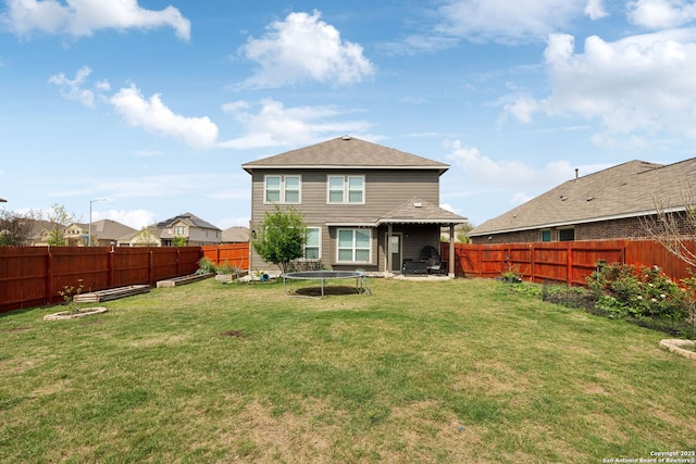 13850 Cohan Way, San Antonio, TX 78253 - rear view of property with a garden, a trampoline, a yard, and a fenced backyard