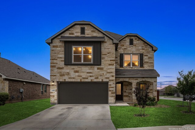 13850 Cohan Way, San Antonio, TX 78253 - view of front facade featuring stone siding, concrete driveway, a yard, and an attached garage