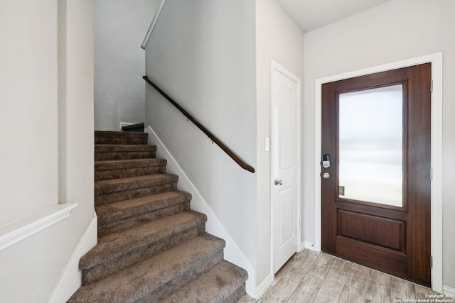 13850 Cohan Way, San Antonio, TX 78253 - foyer with light wood finished floors and stairs