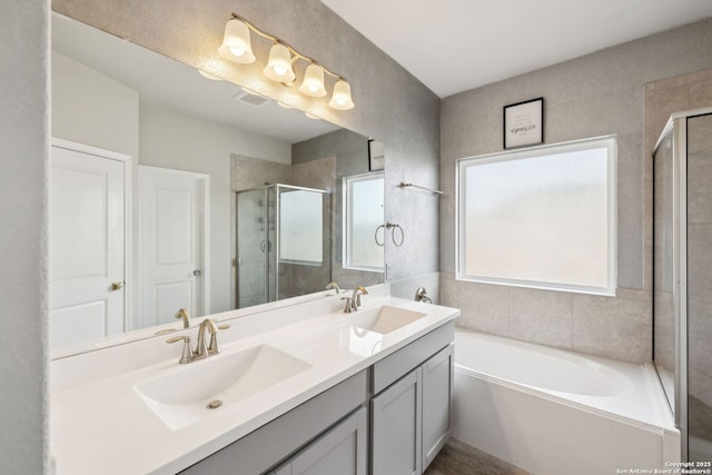 13850 Cohan Way, San Antonio, TX 78253 - full bath featuring a bath, double vanity, a sink, and a stall shower