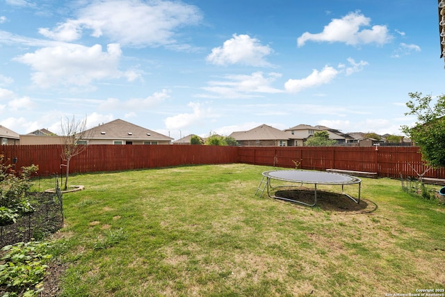 13850 Cohan Way, San Antonio, TX 78253 - view of yard with a fenced backyard and a trampoline