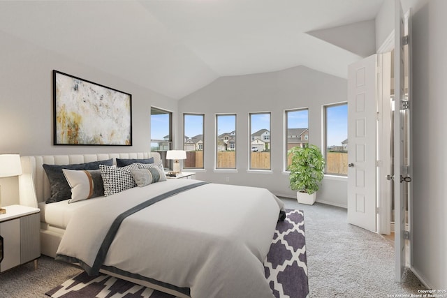 bedroom with carpet and vaulted ceiling