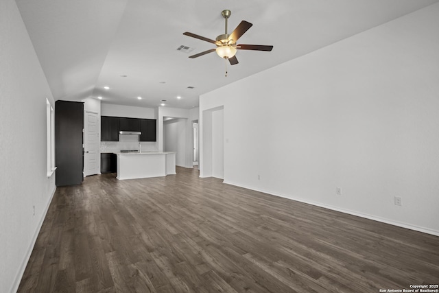 10281 Bartenheim Dr, Schertz, TX 78154 - unfurnished living room featuring a ceiling fan, dark wood-style flooring, baseboards, recessed lighting, and vaulted ceiling