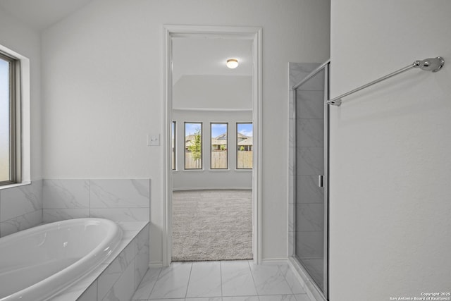 10281 Bartenheim Dr, Schertz, TX 78154 - bathroom featuring marble finish floors, a shower stall, and a garden tub