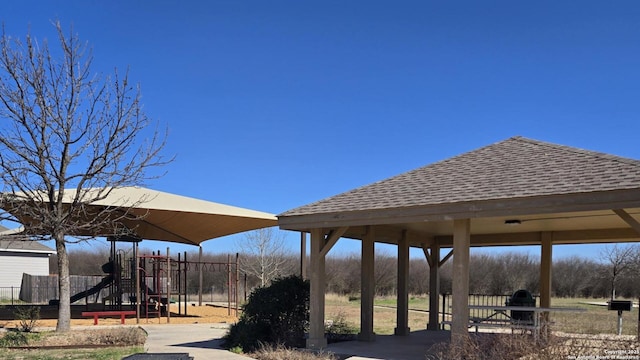 view of home's community featuring a gazebo, fence, and playground community