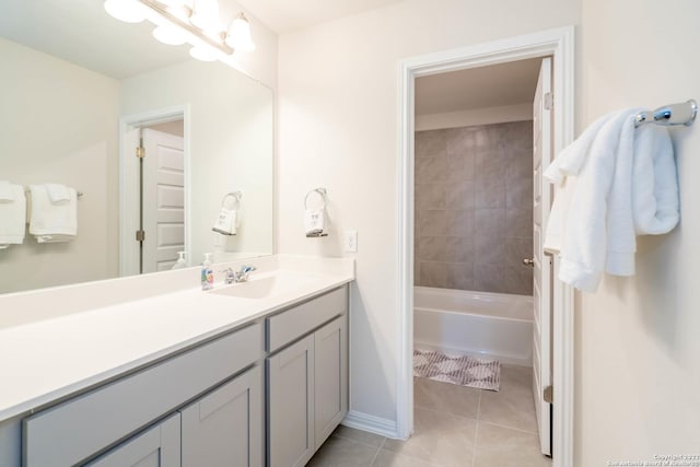 bathroom with baseboards, tile patterned flooring, and vanity