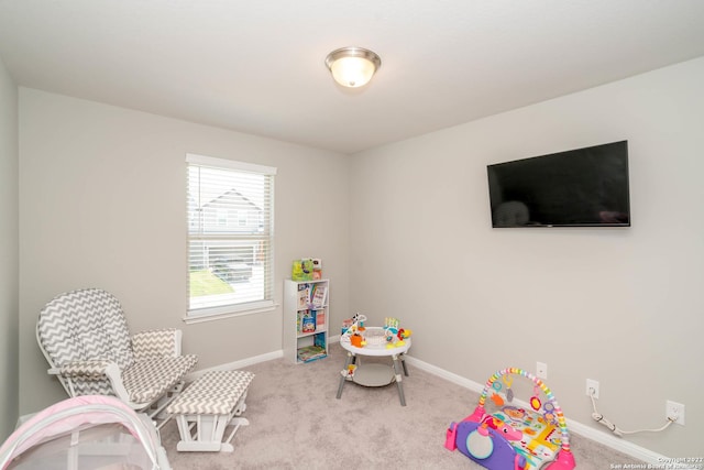 playroom with baseboards and carpet floors