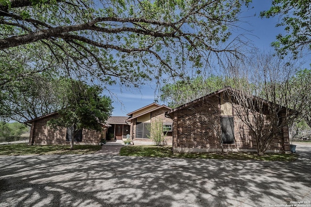 view of front of house with brick siding