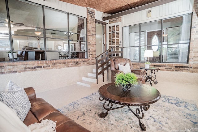 living room with brick wall