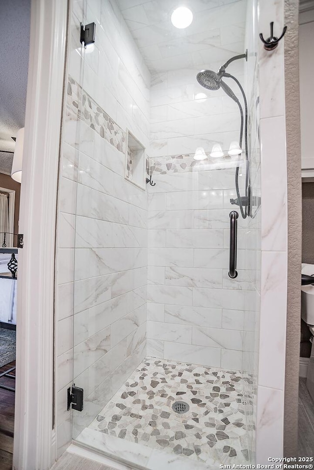 full bathroom featuring a stall shower