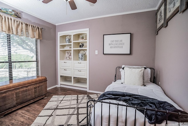 bedroom featuring a textured ceiling, ceiling fan, ornamental molding, and dark wood finished floors