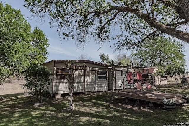 view of yard with a wooden deck