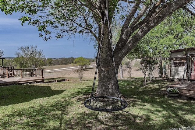 view of yard with a wooden deck