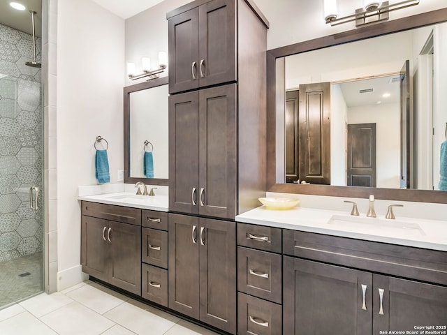 full bath featuring a shower stall, tile patterned flooring, and vanity