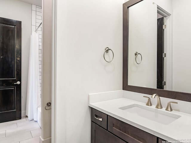 bathroom featuring shower / tub combo with curtain and vanity