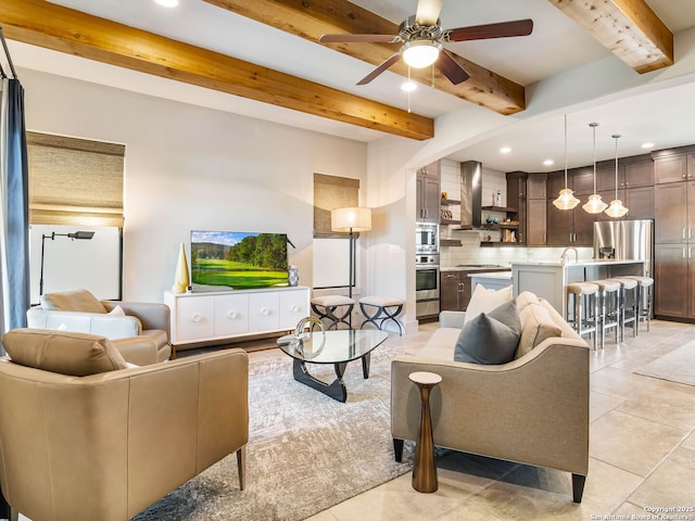 living area featuring beam ceiling, ceiling fan, recessed lighting, and light tile patterned floors